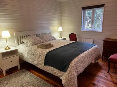 Un ou plusieurs lits dans un hébergement de l'établissement Maison de vacances cosy à 5mn de la plage