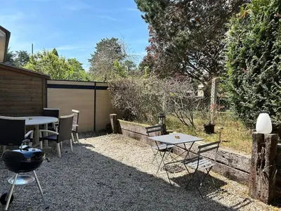 Jardin de l'établissement Maison de vacances cosy à 5mn de la plage