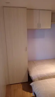 Un ou plusieurs lits dans un hébergement de l'établissement Mobil-home camping 4 étoiles cancale