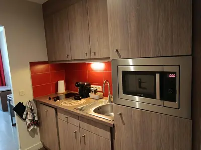 Cuisine ou kitchenette dans l'établissement Au bord de l'orne