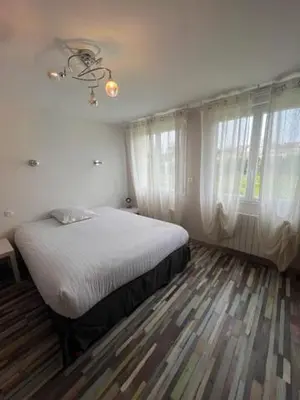 Un ou plusieurs lits dans un hébergement de l'établissement Maison du manoir