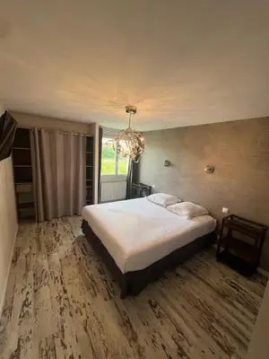 Un ou plusieurs lits dans un hébergement de l'établissement Maison du manoir