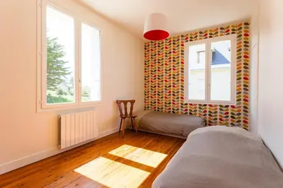 Un ou plusieurs lits dans un hébergement de l'établissement Superb beach-front family house