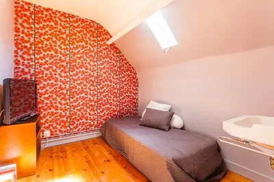 Un ou plusieurs lits dans un hébergement de l'établissement Superb beach-front family house