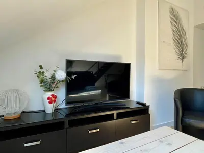 Télévision ou salle de divertissement dans l'établissement Le Loft Saint-Martin by Melrose