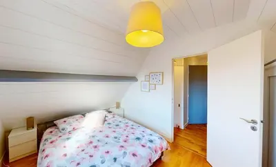 Un ou plusieurs lits dans un hébergement de l'établissement Superbe duplex familial Parking Plage à pied