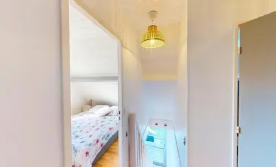 Un ou plusieurs lits dans un hébergement de l'établissement Superbe duplex familial Parking Plage à pied