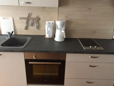 Cuisine ou kitchenette dans l'établissement Grand JUNO