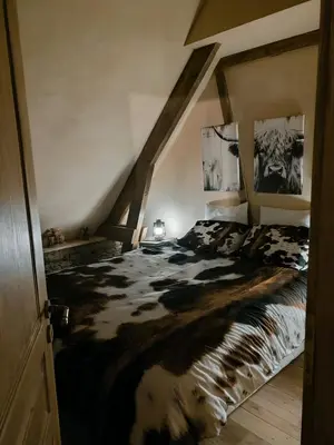 Un ou plusieurs lits dans un hébergement de l'établissement Le Ranch Normand