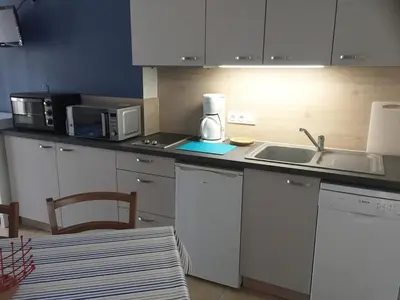 Cuisine ou kitchenette dans l'établissement Studio PETIT JUNO