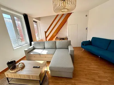 Coin salon dans l'établissement Maison en Triplex proche centre-ville