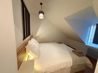 Un ou plusieurs lits dans un hébergement de l'établissement Maison en Triplex proche centre-ville