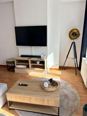 Télévision ou salle de divertissement dans l'établissement Maison en Triplex proche centre-ville