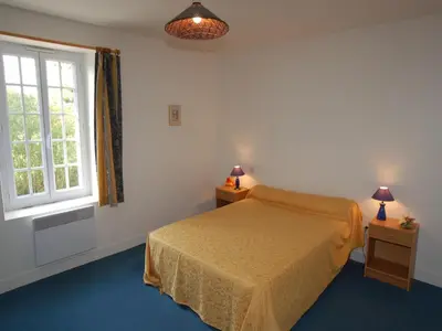 Un ou plusieurs lits dans un hébergement de l'établissement Normandy Family Escape