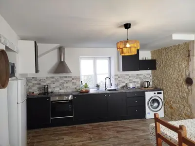 Cuisine ou kitchenette dans l'établissement House near Bayeux