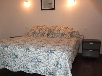 Un ou plusieurs lits dans un hébergement de l'établissement Villa Juliette