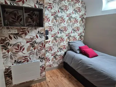 Un ou plusieurs lits dans un hébergement de l'établissement Jolie maison de campagne avec spa en option