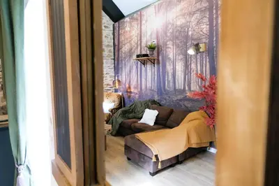 Coin salon dans l'établissement Maison de vacances avec SPA