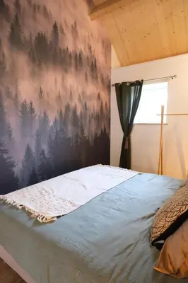 Un ou plusieurs lits dans un hébergement de l'établissement Maison de vacances avec SPA