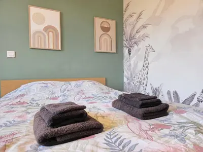 Un ou plusieurs lits dans un hébergement de l'établissement Aux Berges Du Mont - 10 min Mont-Saint-Michel, Jardin & Parking