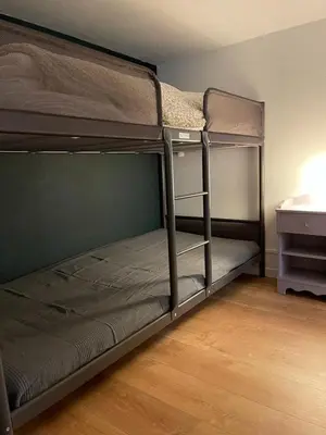 Un ou plusieurs lits dans un hébergement de l'établissement Magnifique appartement avec mezzanine prés Thalasso