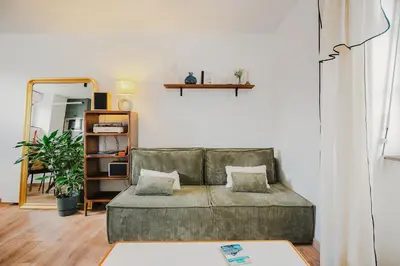 Coin salon dans l'établissement La Baie - Appartement de charme entièrement équipé à 5min du Mont St Michel