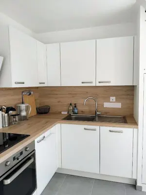 Cuisine ou kitchenette dans l'établissement Appartement neuf, calme et ensoleillé