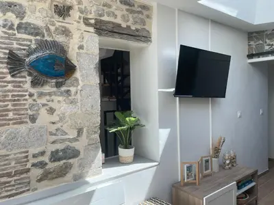 Télévision ou salle de divertissement dans l'établissement Maison Familiale de Centre-Ville