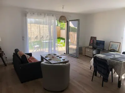 Coin salon dans l'établissement Appartement Verson