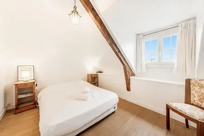 Un ou plusieurs lits dans un hébergement de l'établissement La Bisquine - Maison 3 chambres - Jardin clos