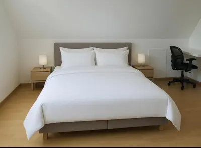 Un ou plusieurs lits dans un hébergement de l'établissement Maison Familiale & Confortable proche Plage