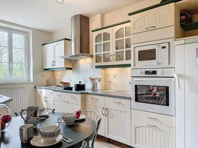 Cuisine ou kitchenette dans l'établissement La Fraisnaie Omaha Beach