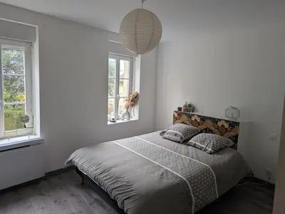 Un ou plusieurs lits dans un hébergement de l'établissement Maison agréable au coeur de Bayeux !