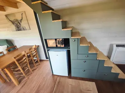 Cuisine ou kitchenette dans l'établissement Tiny House Le Petit Nid du Pré
