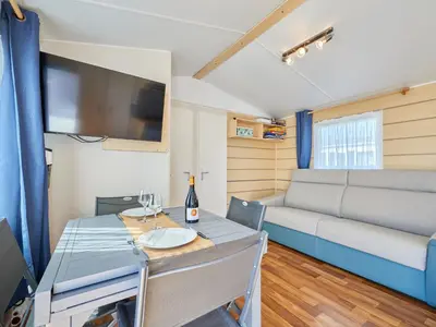Coin salon dans l'établissement Holiday Home Super Octalia - camping 5 by Interhome