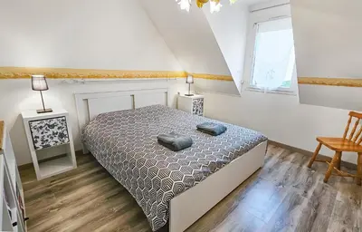 Un ou plusieurs lits dans un hébergement de l'établissement Cousinades and XXL family, terrace