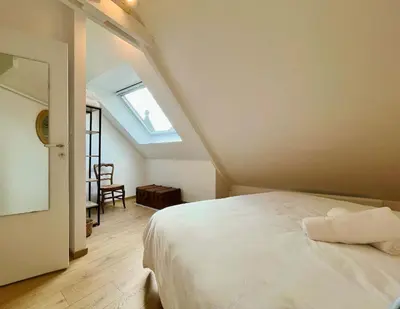 Un ou plusieurs lits dans un hébergement de l'établissement La maison de l'Orangerie - Charm & comfort in the very heart of Carentan
