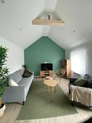 Coin salon dans l'établissement Maison cosy à Aure sur Mer
