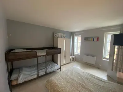 Un ou plusieurs lits dans un hébergement de l'établissement D-Day Cottage La Maove