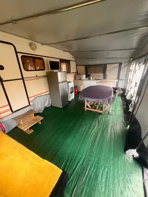 Un ou plusieurs lits dans un hébergement de l'établissement Caravane 4 couchage