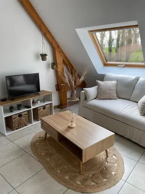 Télévision ou salle de divertissement dans l'établissement Gîte à la campagne