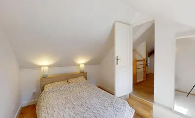 Un ou plusieurs lits dans un hébergement de l'établissement Maison cosy à 2 pas de la mer - Séjour à deux