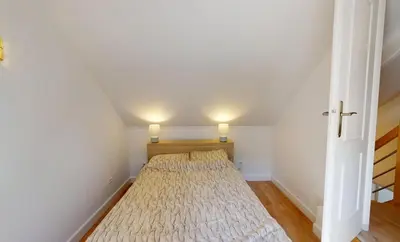 Un ou plusieurs lits dans un hébergement de l'établissement Maison cosy à 2 pas de la mer - Séjour à deux