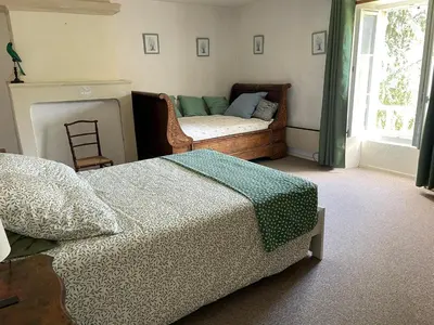 Un ou plusieurs lits dans un hébergement de l'établissement Maison spacieuse entre Bois Mer et Marais