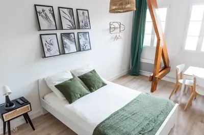 Un ou plusieurs lits dans un hébergement de l'établissement Studio central et cosy à Caen
