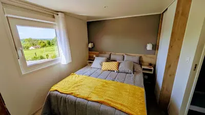 Un ou plusieurs lits dans un hébergement de l'établissement Les petites maisons dans la Monterie La Source