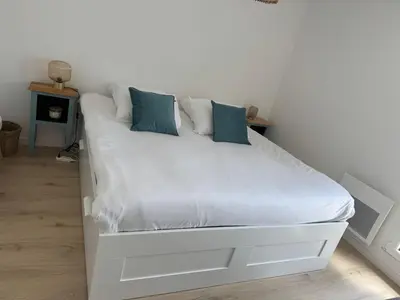 Un ou plusieurs lits dans un hébergement de l'établissement Appartement Le Riva B304