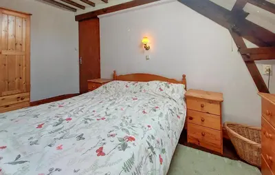 Un ou plusieurs lits dans un hébergement de l'établissement Maison À La Campagne