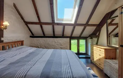 Un ou plusieurs lits dans un hébergement de l'établissement Maison À La Campagne