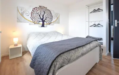 Un ou plusieurs lits dans un hébergement de l'établissement Maison Moderne Proche Plage